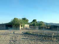 Barn and round pen at M2 Sporthorses, Tucson, Az
